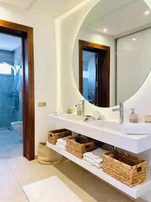 a bathroom with a sink and a mirror at Villa luxe kech in Marrakech