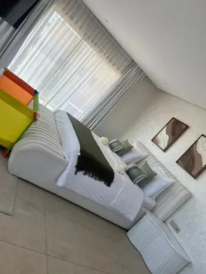a bed sitting on the floor in a room at Villa luxe kech in Marrakech