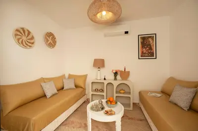 a living room with a couch and a table at Riad Deva Lina in Marrakech