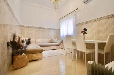 a living room with a couch and a table at Gold Holidays 02 in Marrakech