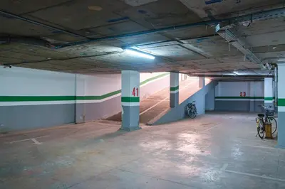 an empty parking garage with two bikes parked in it at Charming Apartment in Hyper Center Modernity in Marrakech