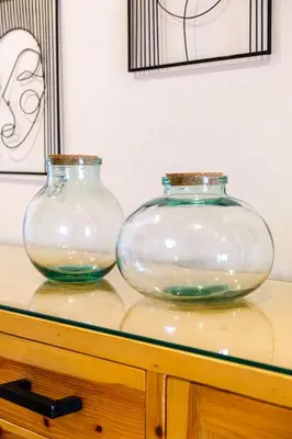 two glass vases sitting on top of a wooden table at Coralia - Cozy Apartment - Secure residence - Pool in Marrakech