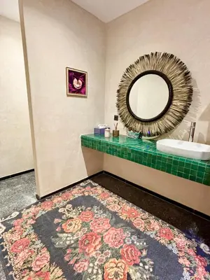 a bathroom with a sink and a mirror at Palais Celeste in Marrakech