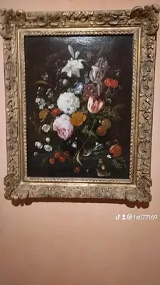 a picture of a painting of flowers on a wall at Al andalous in Marrakech