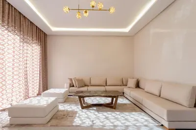 a living room with a couch and a table at Villa located at Argan Golf Resort Prestigia in Marrakech
