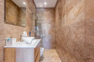 a bathroom with a sink and a shower and a toilet at Villa located at Argan Golf Resort Prestigia in Marrakech