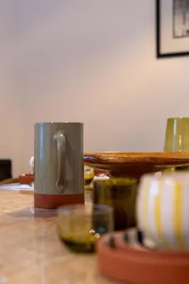 a coffee mug sitting on top of a table at Riad Sofia Marrakech in Marrakech