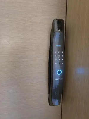 a remote control sticking out of a wooden door at Sublime Apartment at Prestigia Golf, Marrakech in Marrakech