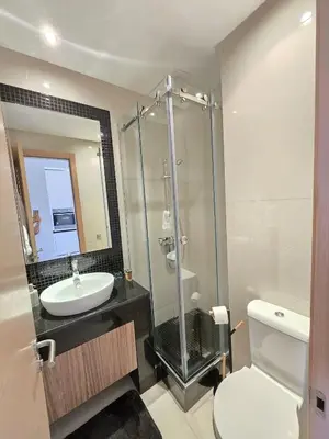 a bathroom with a shower and a sink and a toilet at Sublime Apartment at Prestigia Golf, Marrakech in Marrakech