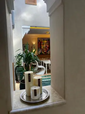 a hallway with two candles on a plate in a room at Riad Casa Maria in Marrakech