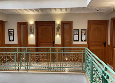 a balcony in a building with wooden doors at Riad Casa Maria in Marrakech