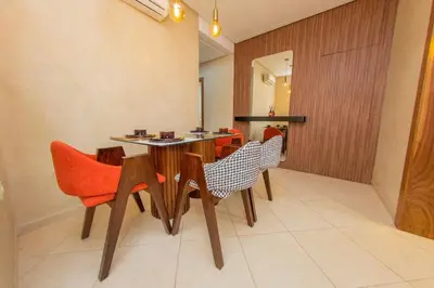 a dining room with a table and chairs at Luxueux Appartement Avec piscine in Marrakech