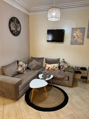 a living room with a couch and a table at A bright and airy living room in Marrakech