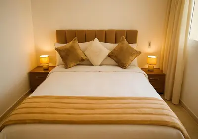 a bedroom with a large bed with two lamps at Gate 3 in Marrakech