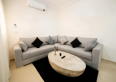 a living room with a couch and a coffee table at Gate 3 in Marrakech