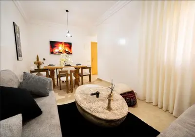 a living room with a couch and a table at Gate 3 in Marrakech