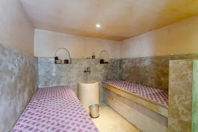 a bathroom with a tub and a sink in it at Riad LOU, 5 bedrooms, private 12 p, pool, hammam in Marrakech