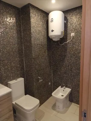 a bathroom with a white toilet and a sink at Magnifique studio douillet in Marrakech