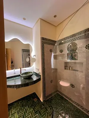a bathroom with a shower and a sink at Riad Appart F3 Exceptionnel à Guéliz - À 5 min de la gare - Piscine, Wi-Fi et parking au cœur de Marrakech in Marrakech