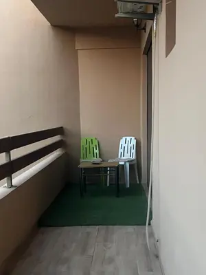 two chairs and a table in a room at Nor in Marrakech