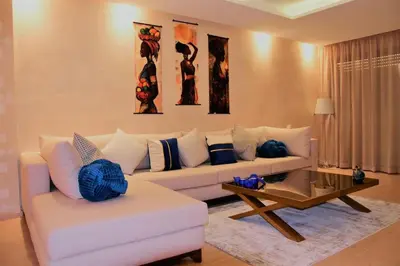 a living room with a couch and a coffee table at Apartement in Marrakech Village Prestigia - 2 Bedrooms - private pool in Marrakech