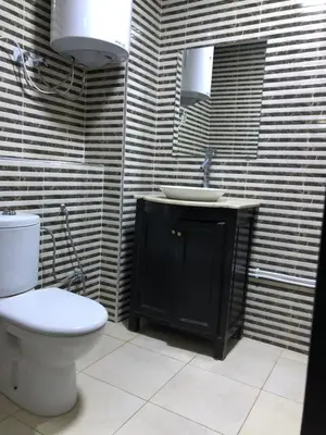 a bathroom with a toilet and a sink at - Résidence Babylone Y - 3 Bedrooms Appartement in Marrakech