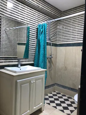 a bathroom with a sink and a shower at - Résidence Babylone Y - 3 Bedrooms Appartement in Marrakech