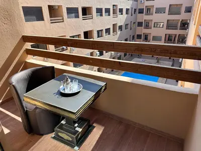 a table on the balcony of a building at Gueliz flat centre in Marrakech