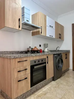 a kitchen with a stove and a dishwasher at Gueliz flat centre in Marrakech