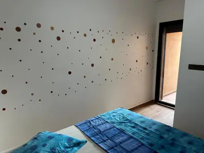 a bedroom with a wall with spheres on it at Gueliz flat centre in Marrakech