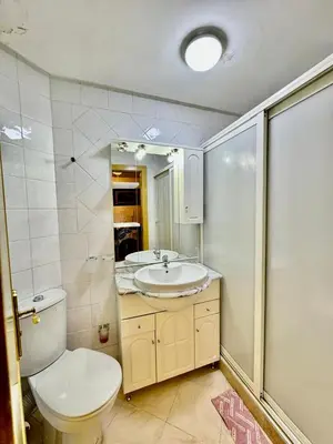 a bathroom with a toilet and a sink at spacieux appart familial avec 2 chambres in Marrakech