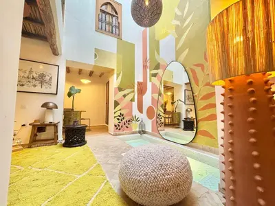 a room with a large mirror on the wall at Riad Fleur de Kasbah in Marrakech