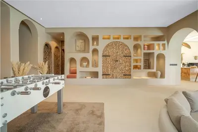 a living room with a large room with an archway at Villa Bali Amelkis in Marrakech