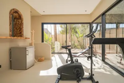 a room with a gym with a treadmill at Villa Bali Amelkis in Marrakech