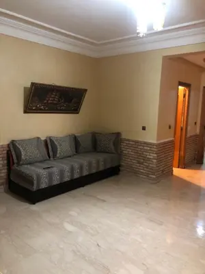 a living room with a couch in the corner at - Résidence Babylone Y - Appartement 3 Chambres in Marrakech