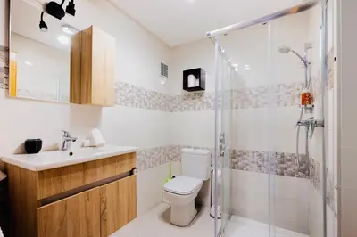 a bathroom with a toilet sink and a shower at Évasion aux portes de Majorelle in Marrakech