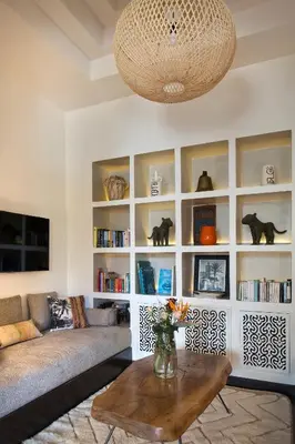 a living room with a couch and a table at Villa Jardin Nomade in Marrakech