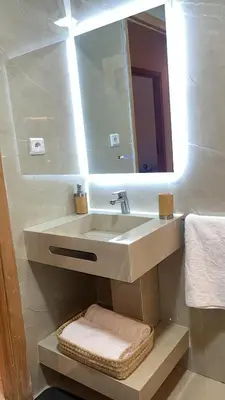 a bathroom with a sink and a mirror at Darraha- Ideal for early & Late flights-Near Marrakech airport 10 min- menara Garden 5 min-Transport support in Marrakech