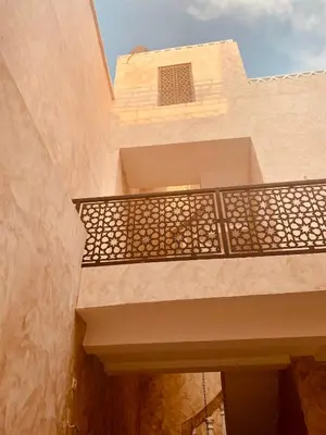 a building with a balcony with a window at 66 Dar Aarab - Marrakech in Marrakech