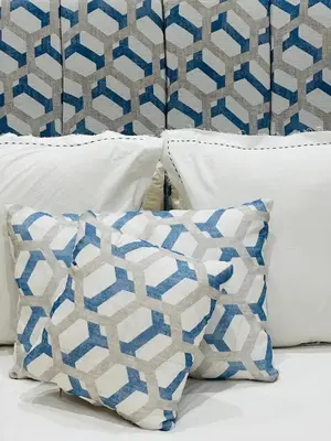 a group of pillows sitting on top of a bed at 66 Dar Aarab - Marrakech in Marrakech