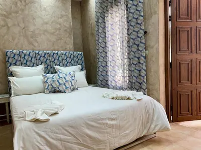 a bedroom with a bed with towels on it at 66 Dar Aarab - Marrakech in Marrakech