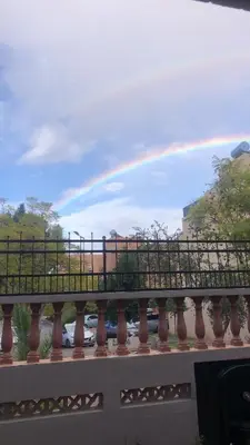 a rainbow in the sky over a bridge at Ghazaly house in Marrakech