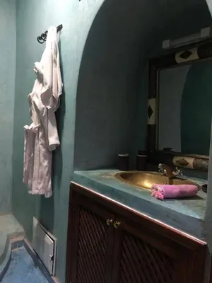 a bathroom with a sink and a mirror at Ghazaly house in Marrakech