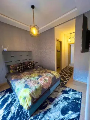 a bedroom with a large bed in a room at séjournée chez mayaa in Marrakech
