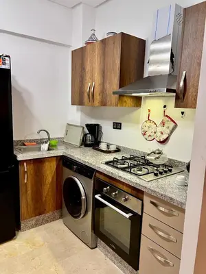 a kitchen with a stove and a stove top oven at séjournée chez mayaa in Marrakech
