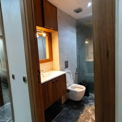 a bathroom with a toilet and a sink and a shower at Modern 2-Bedroom Family Flat in Central Marrakech in Marrakech