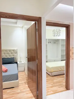 a bedroom with a bed and a mirror at N47 Confortable Près De Gueliz FAMILY in Marrakech