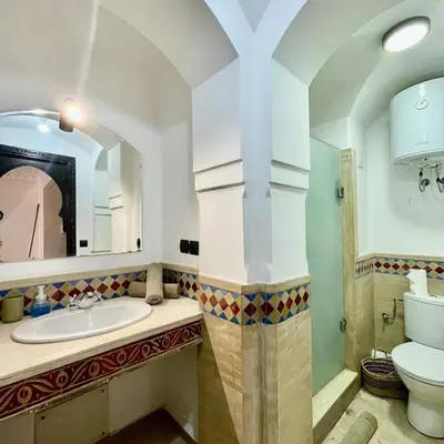 a bathroom with a sink and a toilet at In Gueliz, Chic and Ethnic with a palm view in Marrakech
