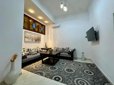 a living room with a couch and a table at Modern & Chic Duplex Near The Center, Brand New in Marrakech