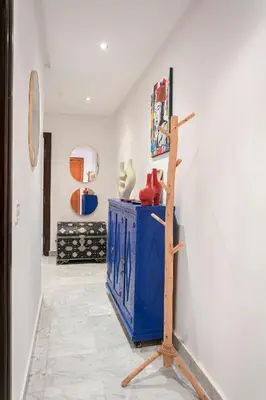 a room with a blue cabinet and a wall at Gueliz's Sun Marrakesh Centre in Marrakech